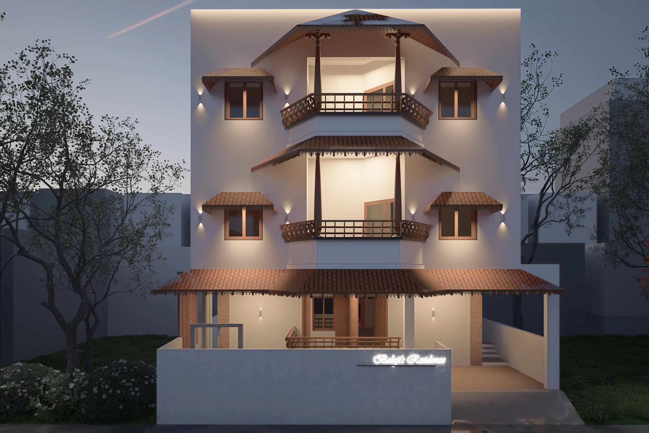 Balaji Sudarsana's Residence, Balaji nagar — the front elevation at dusk, three storeys of balconies under terracotta tiled canopies with the house lit from within.