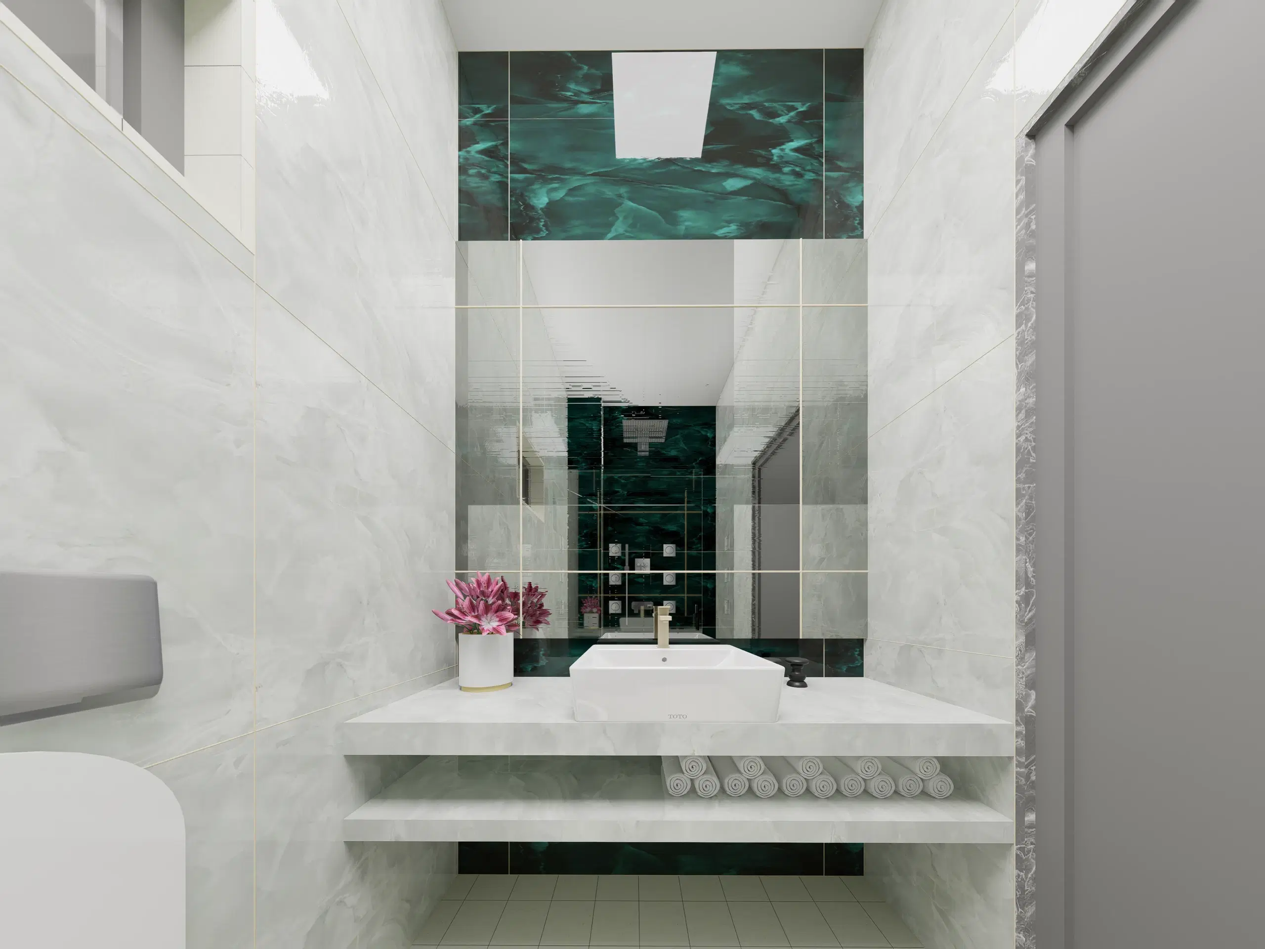 Fortune enclave, Balaji nagar — the vanity in the green marble bathroom, a vessel basin on a stone shelf below a backlit niche.