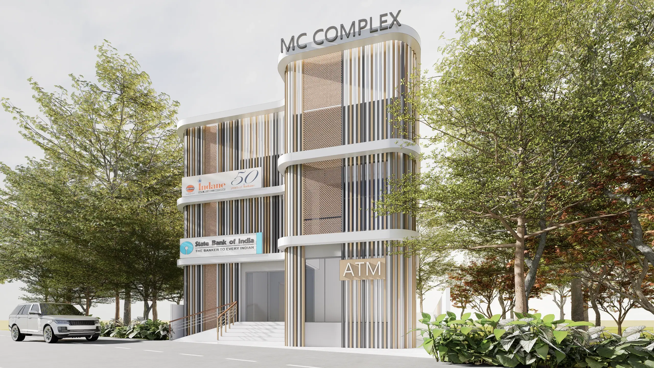 MC Complex, Thillai Nagar — the approach from the street, the building set behind mature trees with the entrance stair and ATM to the right.