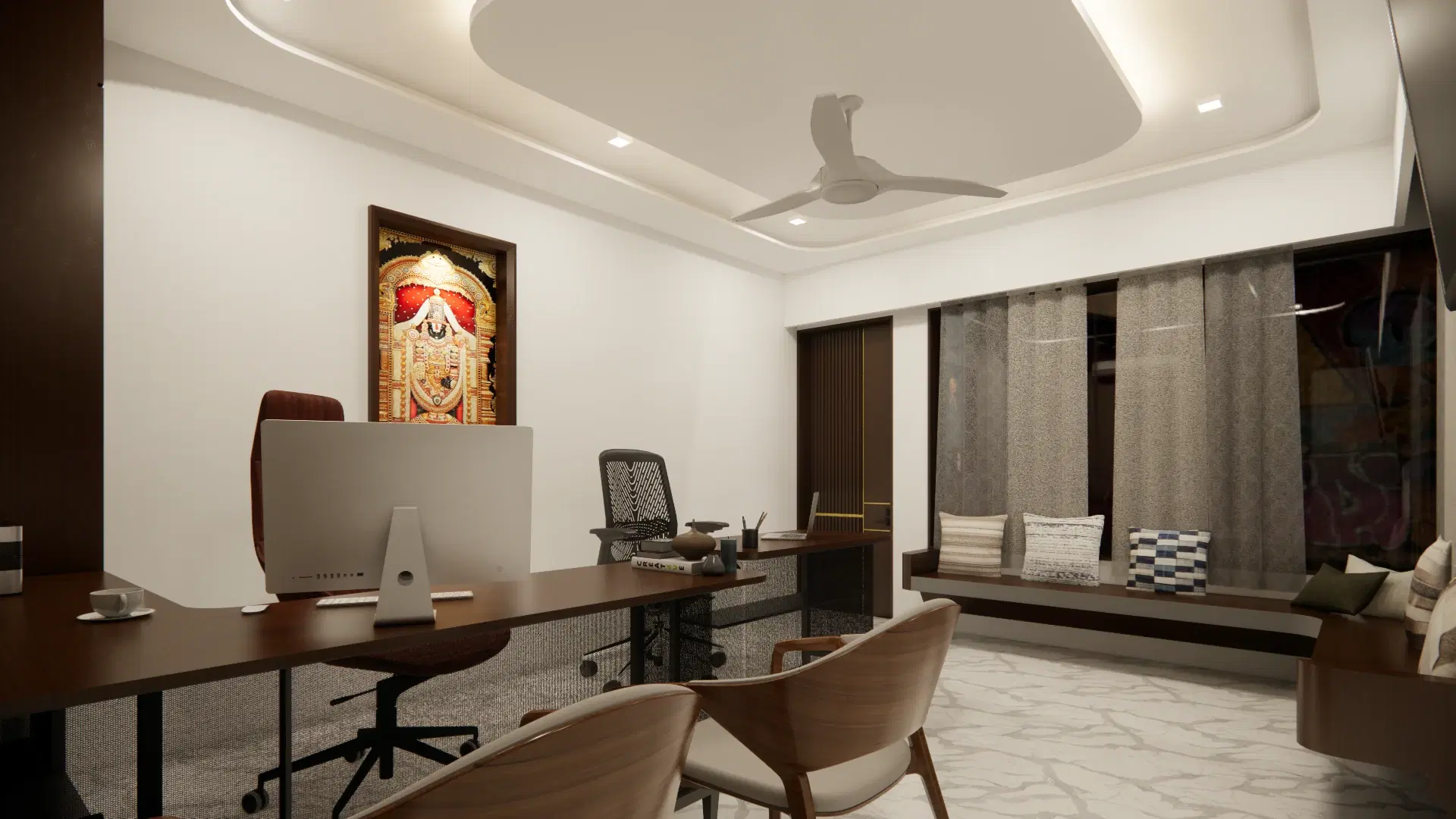 SRM Office, Madaiyur — the private office, desk and monitor set against a panelled wall with a framed deity portrait and a window seat beyond.