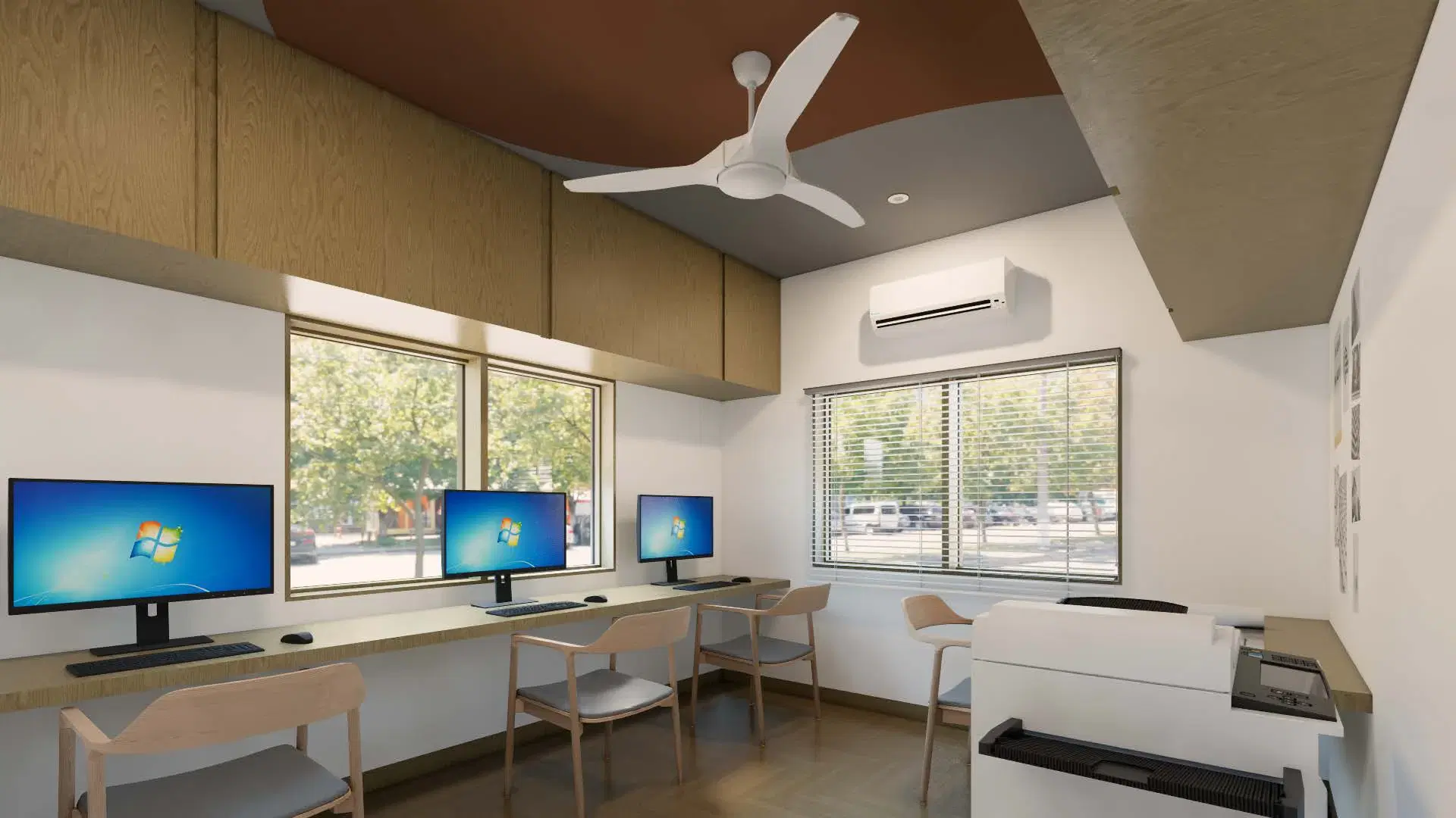 SRM Office, Madaiyur — the workstation room, three desks running beneath the windows with the plotter and storage along the back wall.