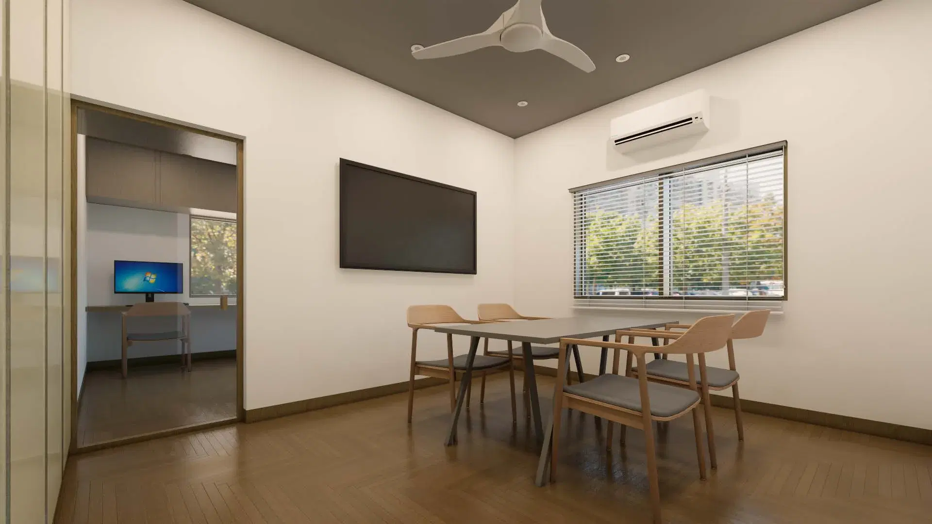 SRM Office, Madaiyur — the meeting room on its timber floor, the screen wall opposite and the workstation room visible through the opening.
