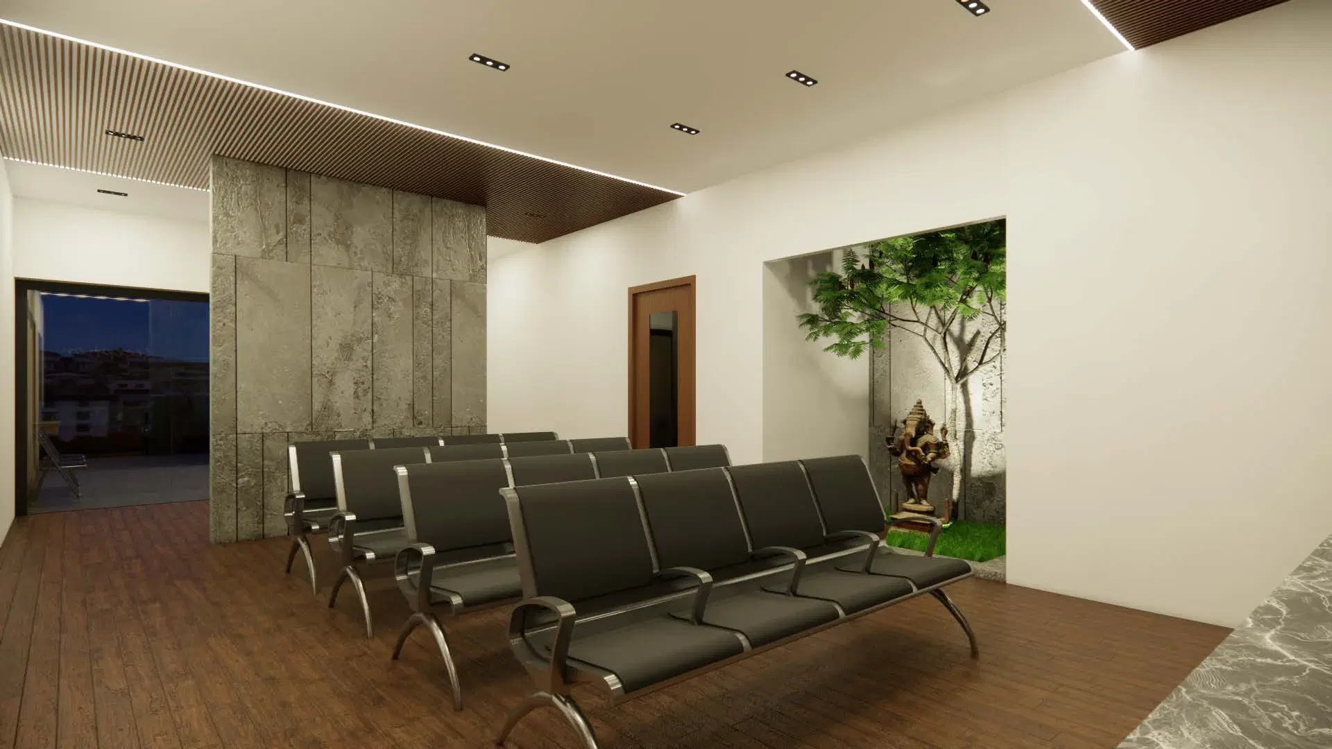 Vinayaga Nursing Home, Manikandam — the indoor waiting area, steel benches on a timber floor against a figured stone wall.