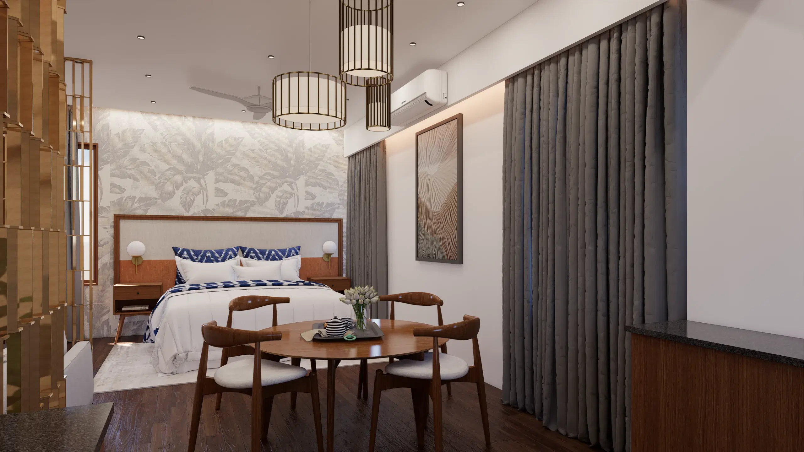 SVH studio apartment, Cantonment — the bedroom end, bed against a patterned wall with a round dining table and full-height curtains alongside.