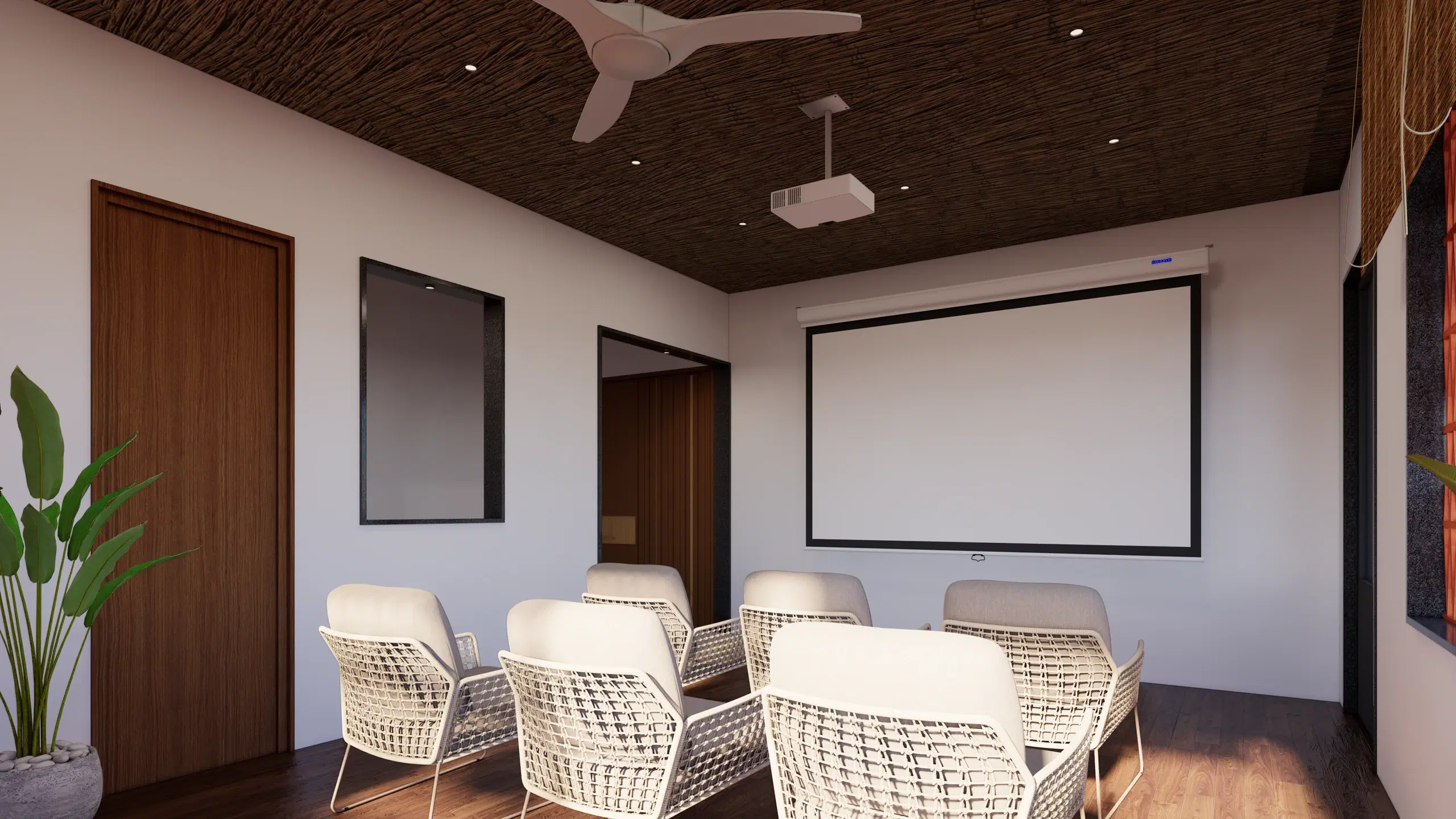 SVH studio apartment, Cantonment — the seminar room, white cane chairs facing a projection screen under a dark timber ceiling.